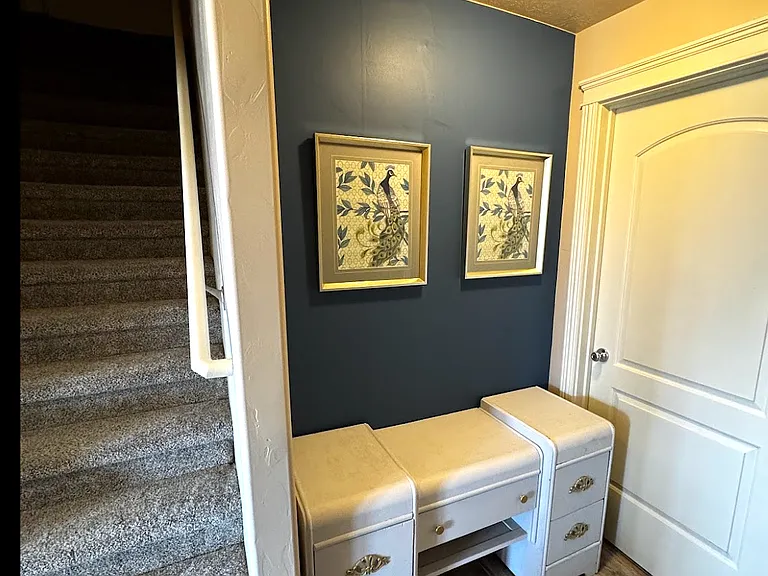 Study nook at the bottom of the stairs. Includes waterfall desk.