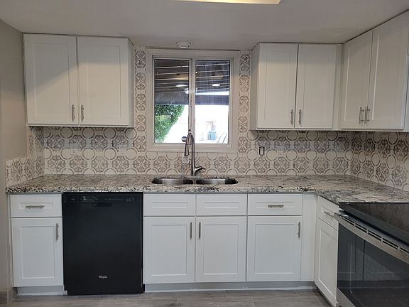 New counters, sink, faucet and garbage disposal.