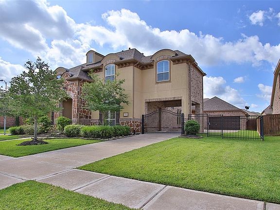 Porta-Cochere and Side door to Kitchen, Oversized Detached Garage with 3 Car Spaces and Work Shop area.  To the side of the Garage is the Outdoor Fireplace and Living Area!  Waiting for YOU to Call it HOME!