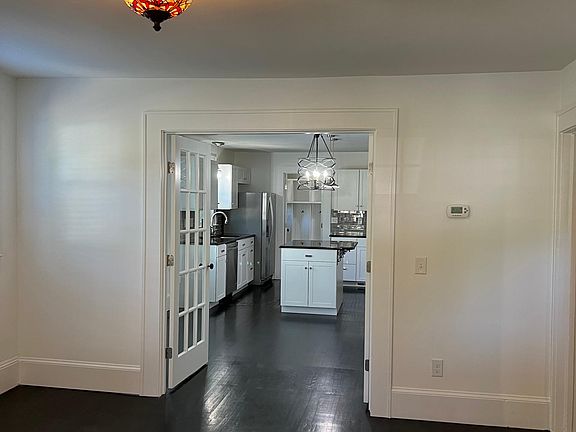 Your living room opens into the dining area and kitchen, though easily separated by French doors if needed.