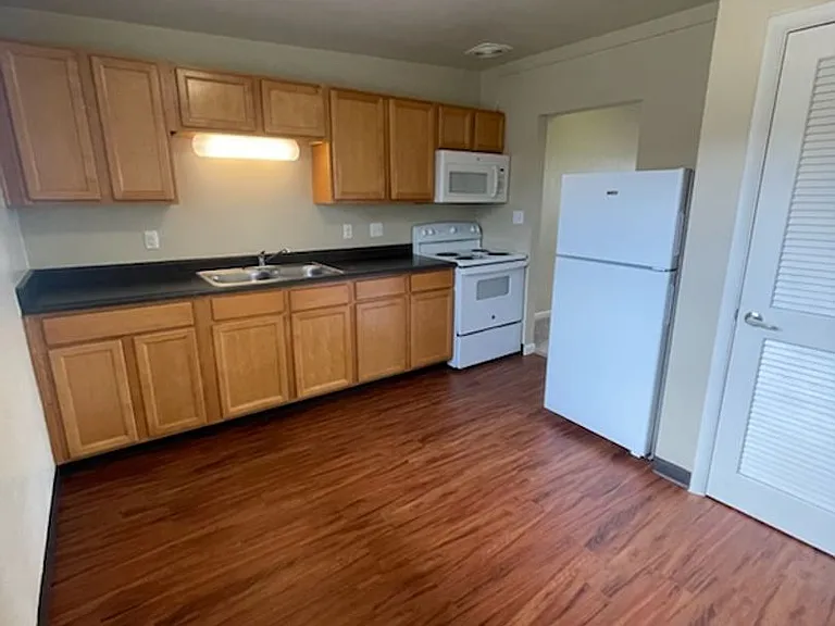 5531-5541 S Delaware St — Photo 1