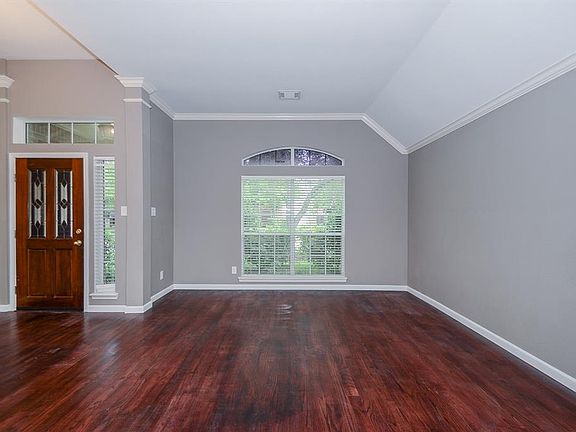Such a warm and welcoming entryway has natural light and offers a transitional space into the main part of the home.