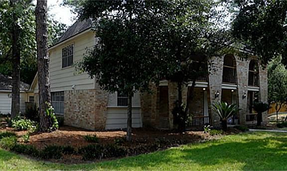 Panoramic view showing the premium wooded corner lot location.