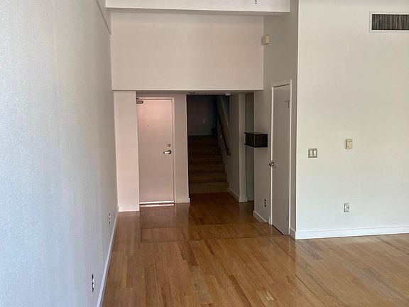 Front door. Staircase up. Closet. 2nd room entry on right side.