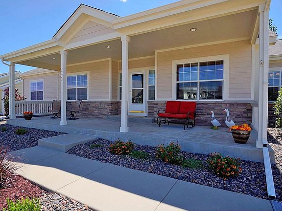 Relax on your Large Country Porch in a quiet neighborhood.