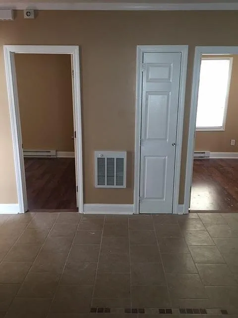 Entrance to two bedrooms from kitchen
