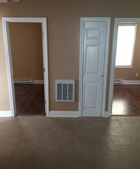 Entrance to two bedrooms from kitchen