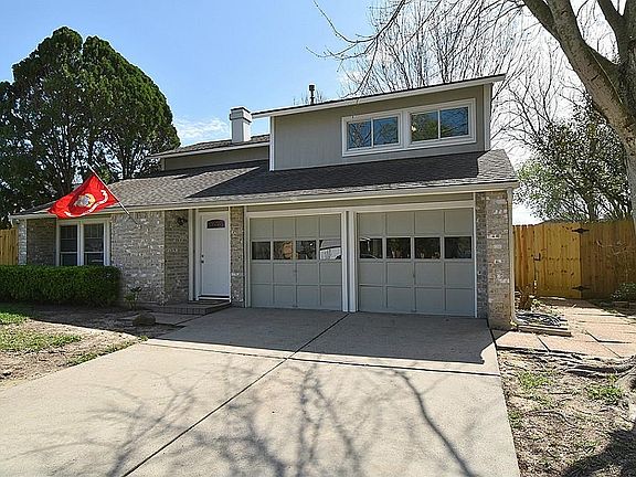 Double wide driveway with 2 car garage