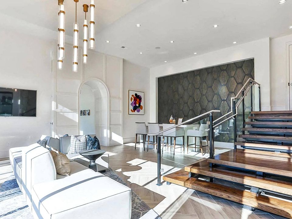 Indoor Lounge Area with Upholstered Sofas and Raised Bar Seating Section