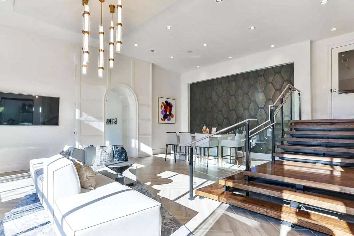 Indoor Lounge Area with Upholstered Sofas and Raised Bar Seating Section