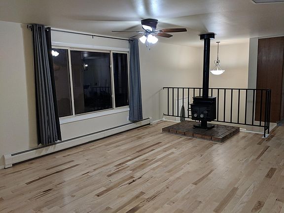 Family room, new hickory wood floors and wood burning stove