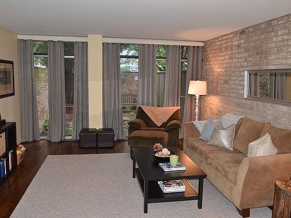Living Room with Exposed Brick and view to private back cour