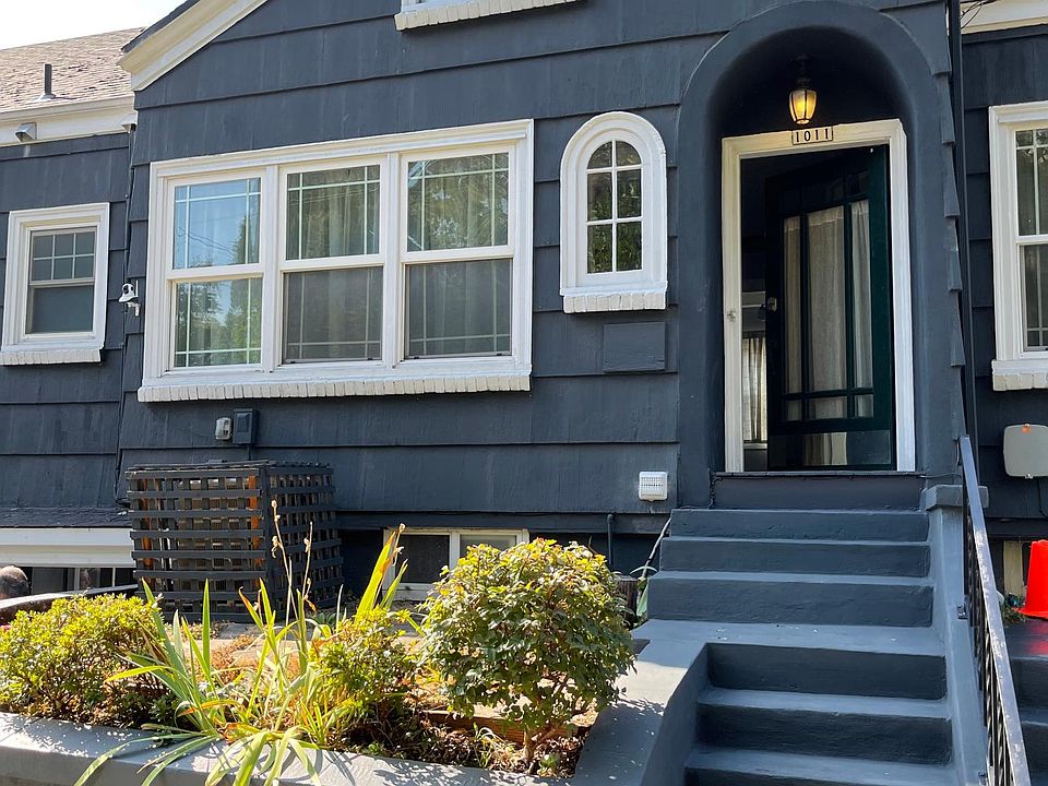 1920's Tudor style row house apartment with a sunny garden patio in a great location in inner SE Belmont.