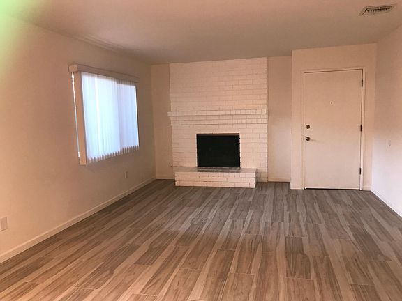 spacious living room with chimney