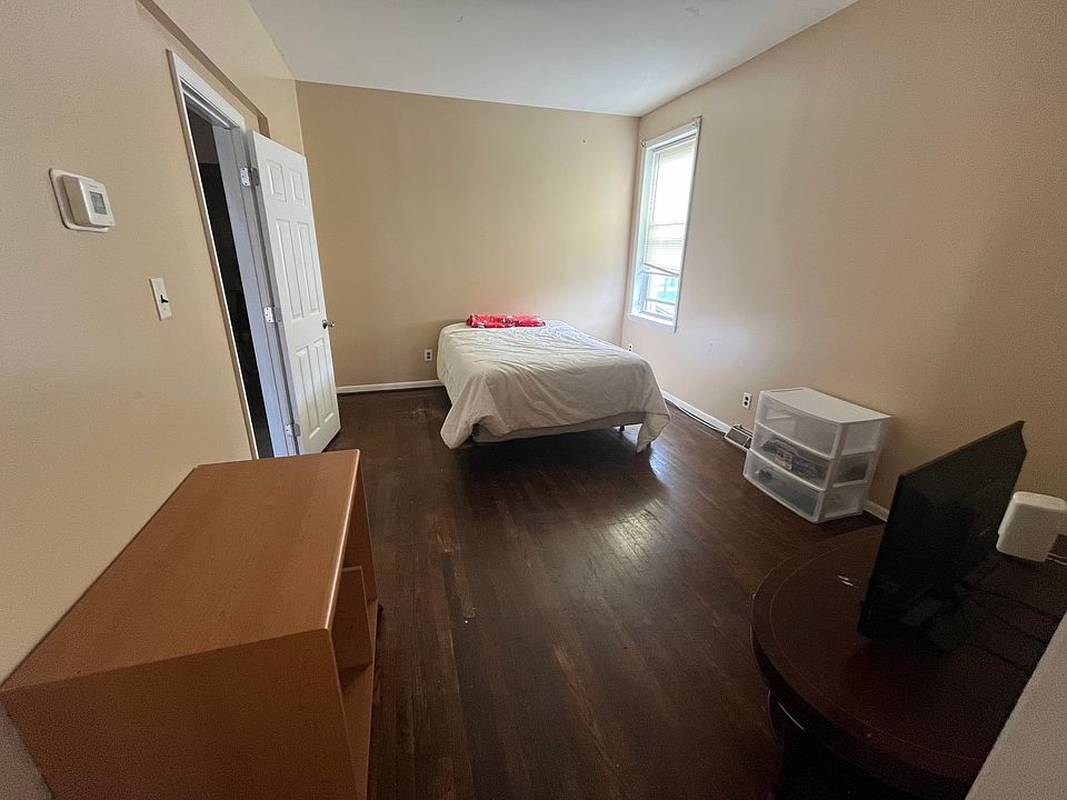 Large bedroom #1 is furnished with bed and tv and desk. Attached to den - rented