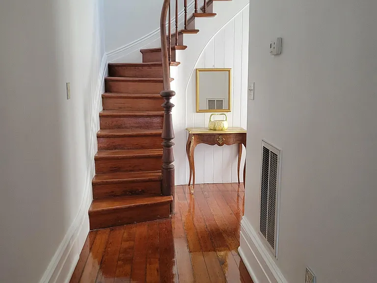Original staircase and rail, to upstairs living quarters