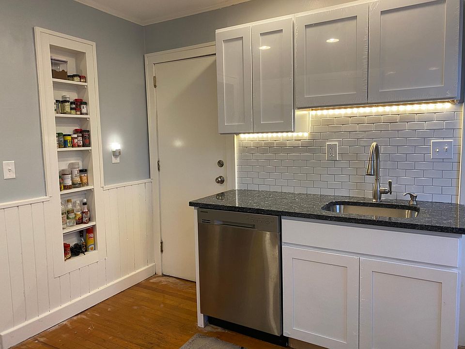 Brand new granite counters, cabinets, appliances. Subway backsplash and under cabinet lighting