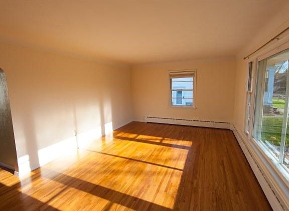Family room off of kitchen, redone hardwood floors.