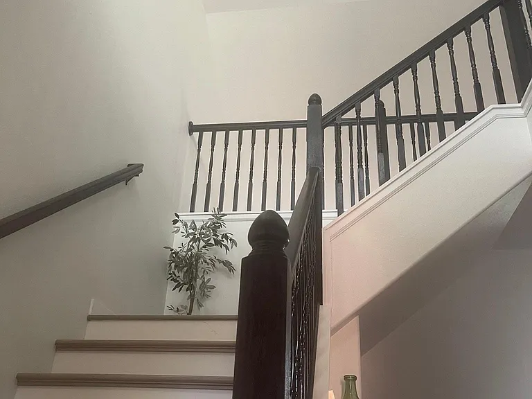 Beautiful updated black steel lighting and staircase. Generous vaulted ceilings throughout the house and in all the upstairs bedrooms.