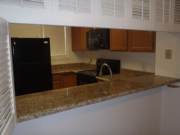 Peek through from dining to kitchen