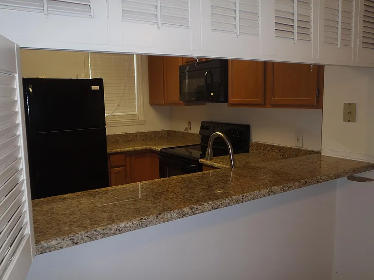 Peek through from dining to kitchen