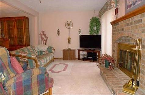 Lovely great room with beautiful brick fireplace