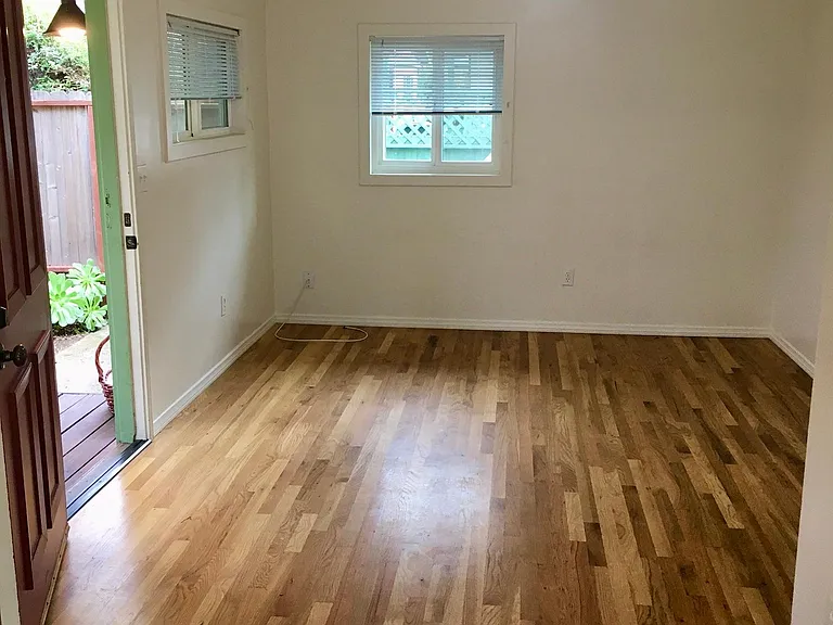 Hardwood floors in living/dining room area.