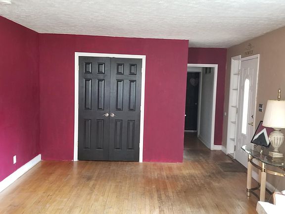 Living Room with built-in 4x8 closet with dual door access.