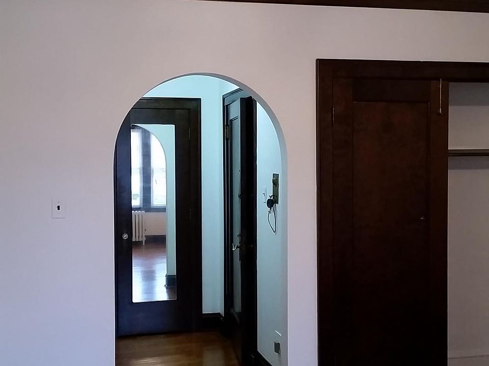 The front entryway. Door with a full-length mirror is a large closet; view is from the living room.