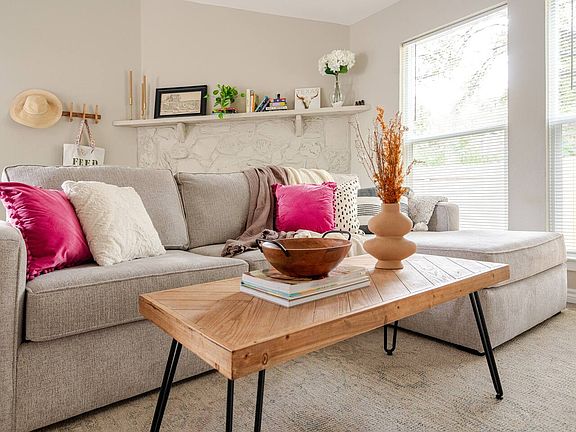 Living room with fireplace and large windows