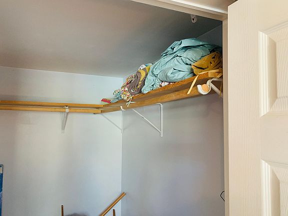 Large walk in closet in bedroom.