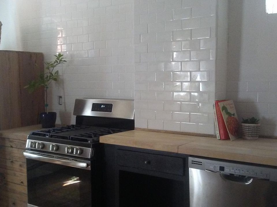 chefs kitchen with butcher block counter tops and all new appliances!