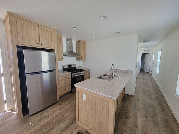 Galley kitchen with stainless steel appliances
