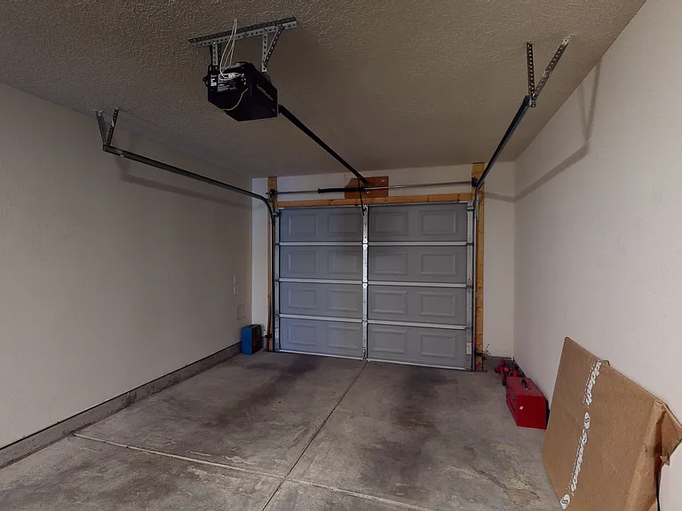 Single car garage with automatic opener.