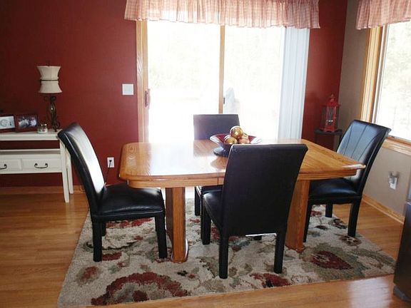 Dining area with sliding door to the large wood deck.