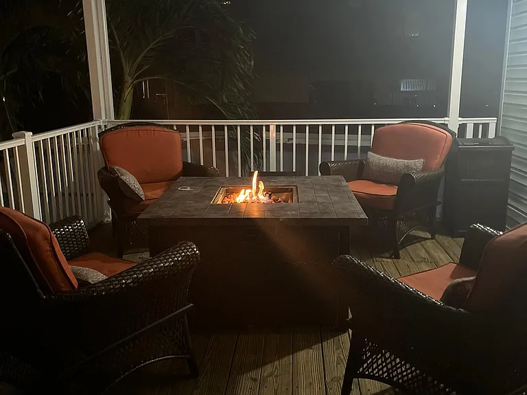 Gas Fire table on deck at night.
