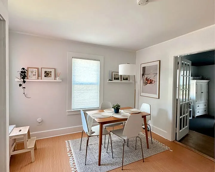 The dining room has two windows. The two bedrooms are off this space.
