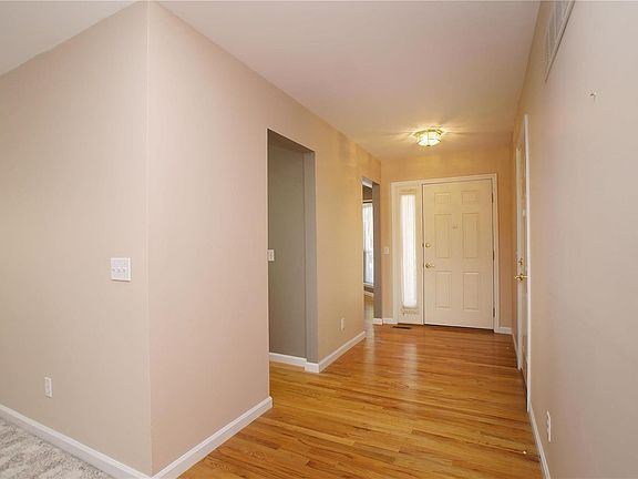 Wide entry foyer with access to garage