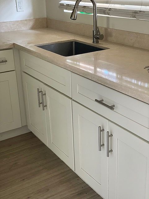 kitchen w new cabinets, counters and appliances