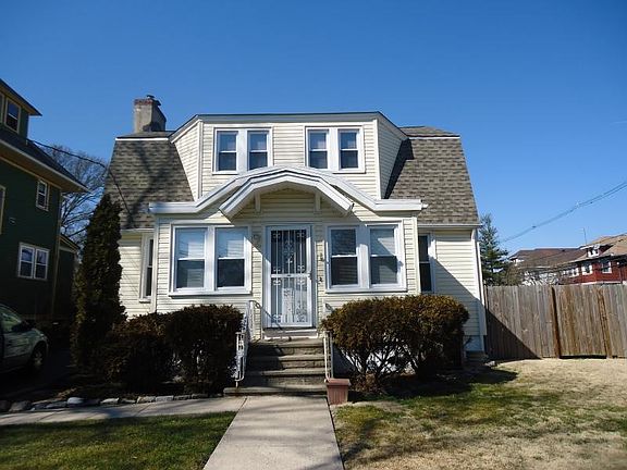 Front view with enclosed porch