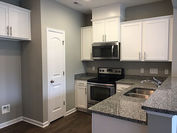 SS Appliances & White Cabnts