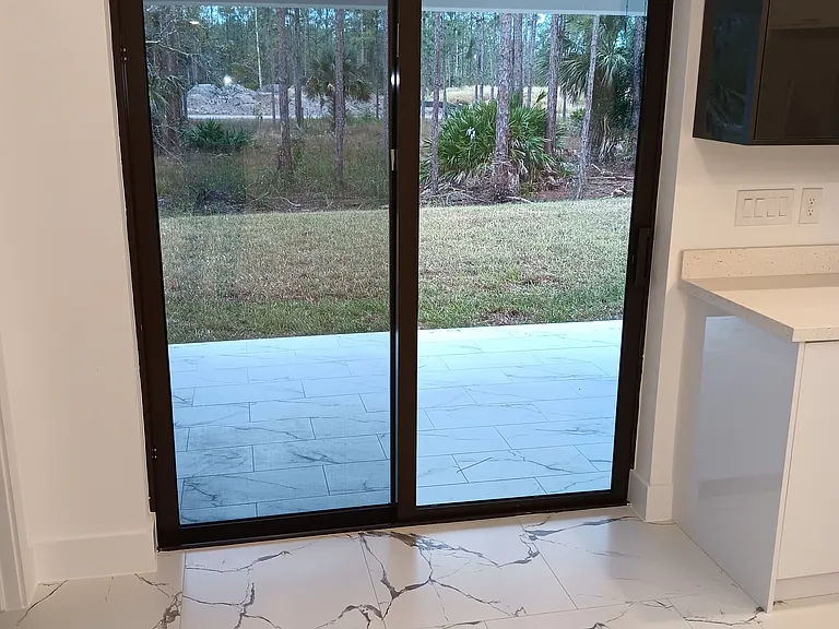 Sliding door to the patio and backyard