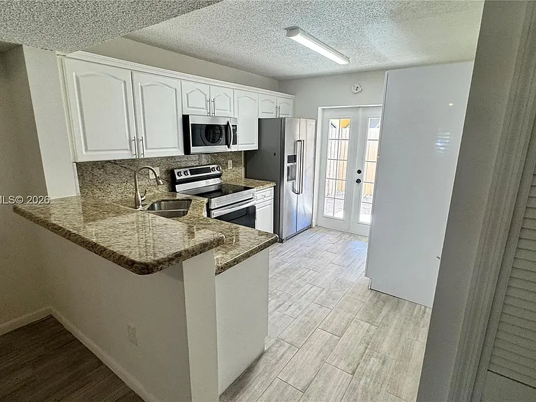 7439 W 22nd Ave #103 — Photo 3