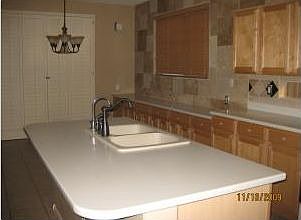 large kitchen, lots of cabinet space, largeisland with seating space for three