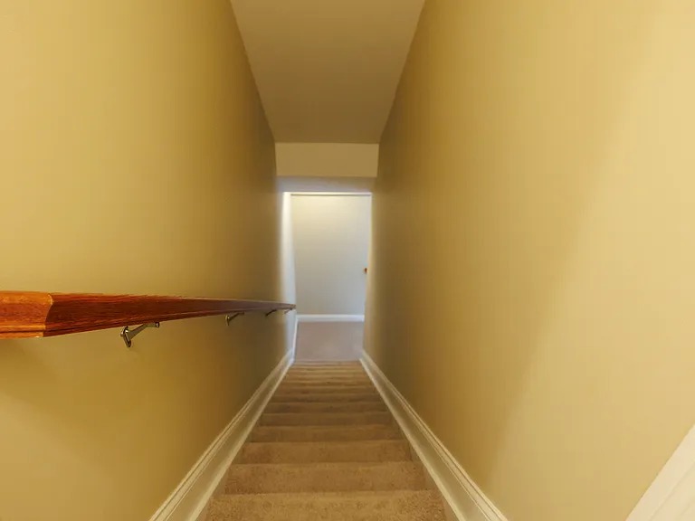 Stairs to lower level bedroom and rec room