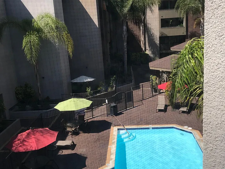 View from bedroom window of pool and hot tub area. Pool is rarely used and the community appreciates the quiet, respectful use of this area by residents. I have owned this unit for many years and have never been impacted by the pool area. It is a nice vi