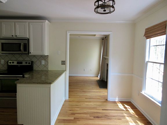 Back side of kitchen leading to living room