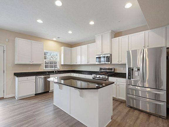 Gourmet Kitchen with upgraded cabinetry, granite counter top and stainless still appliances.