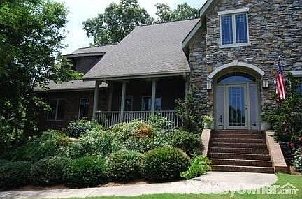 Front View of Home
						:
						Custom design, brick, cedar shingles and stone, new roof and Leafgaurd gutters