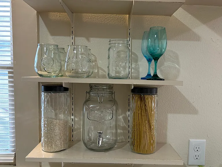 Open shelves in kitchen. Jars not included.